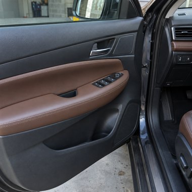 Restored leather car door panel and armrest